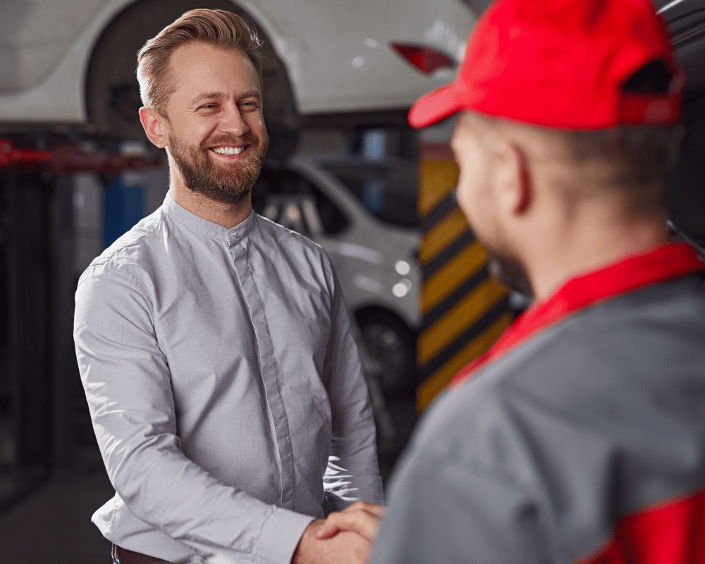 Happy customer shaking hands with a service professional