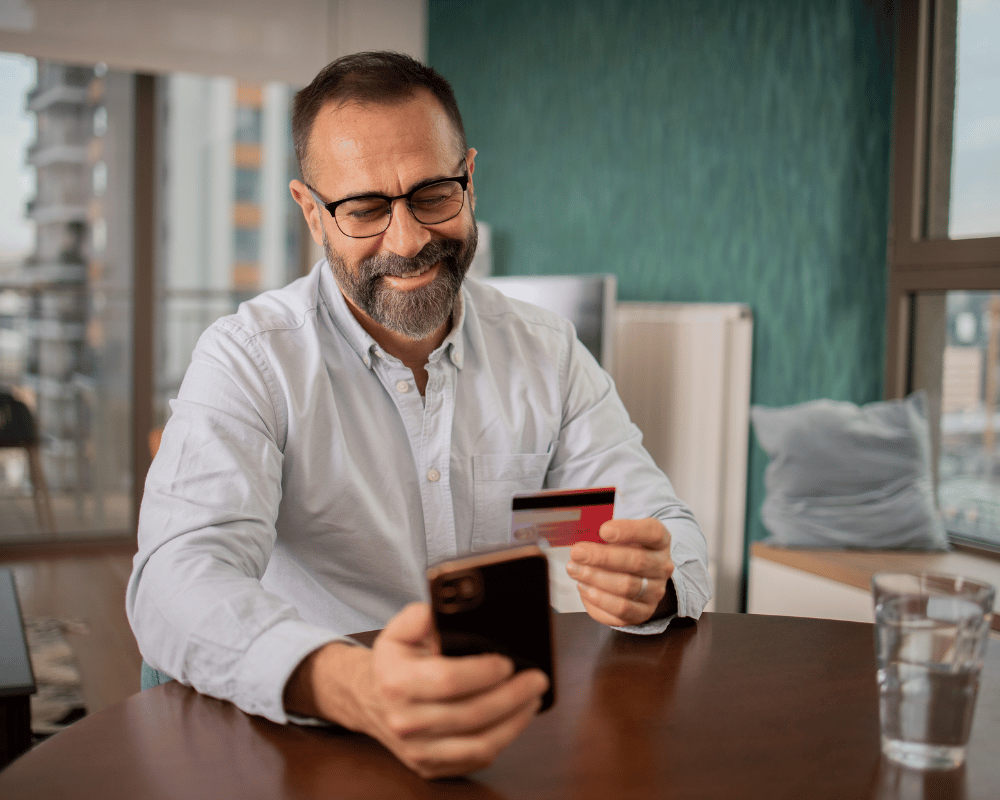 Customer completing a purchase on their phone with a credit card